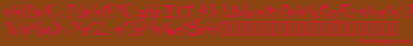 フォントBtBongBlastedAliensTrialTrialVersion – 赤い文字が茶色の背景にあります。