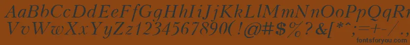 フォントKudrashovItalic.001.001 – 黒い文字が茶色の背景にあります