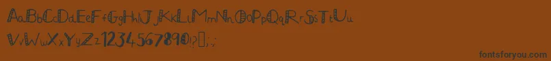 JuliaHandwritten2 Font – Black Fonts on Brown Background