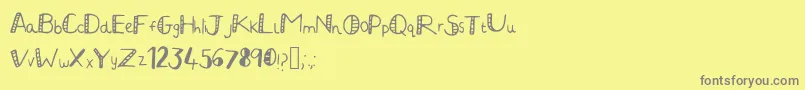 JuliaHandwritten2-Schriftart – Graue Schriften auf gelbem Hintergrund