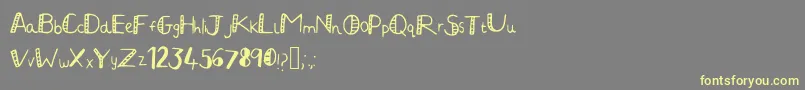 JuliaHandwritten2-Schriftart – Gelbe Schriften auf grauem Hintergrund