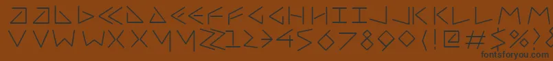 Шрифт Uncialfifty – чёрные шрифты на коричневом фоне