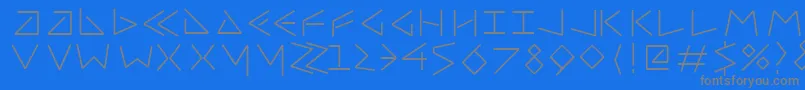 Uncialfifty-fontti – harmaat kirjasimet sinisellä taustalla