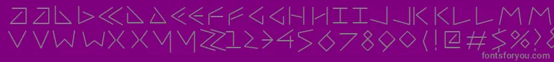 Uncialfifty-fontti – harmaat kirjasimet violetilla taustalla