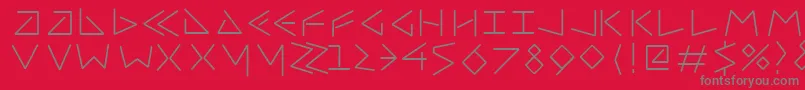 Uncialfifty-fontti – harmaat kirjasimet punaisella taustalla