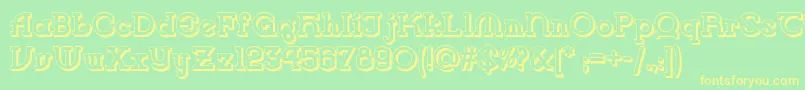 フォントVlaanderen Shadow Nf – 黄色の文字が緑の背景にあります