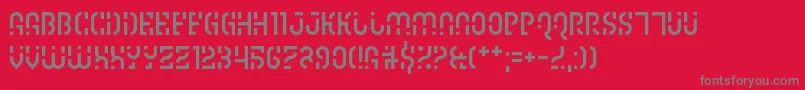 フォントIpscrik – 赤い背景に灰色の文字