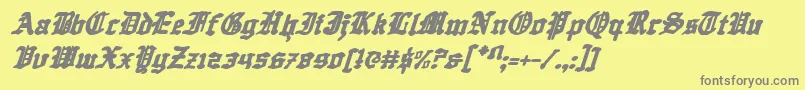 フォントQuestknighti – 黄色の背景に灰色の文字