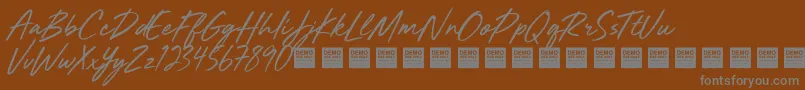 Шрифт MightyRiverDemo – серые шрифты на коричневом фоне