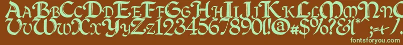 フォントQuillcapitals – 緑色の文字が茶色の背景にあります。