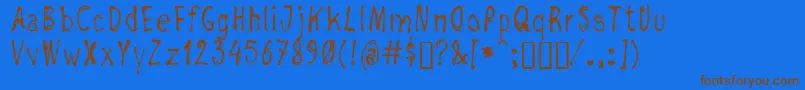 フォントNegada – 茶色の文字が青い背景にあります。