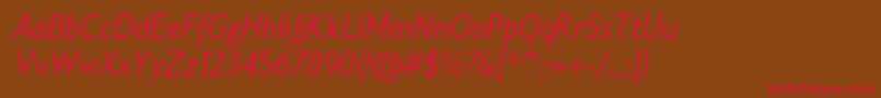 フォントGilliusadfno2Conditalic – 赤い文字が茶色の背景にあります。
