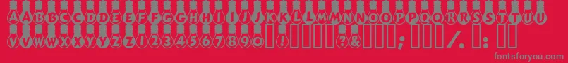 Fonte AmpouleHeavy – fontes cinzas em um fundo vermelho