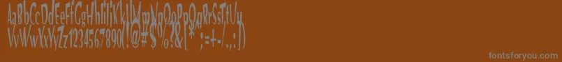 フォントVtcOptikaRegular – 茶色の背景に灰色の文字