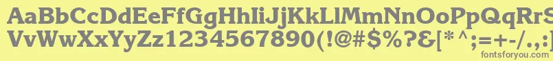 フォントKarlajohnson7Extraboldsh – 黄色の背景に灰色の文字