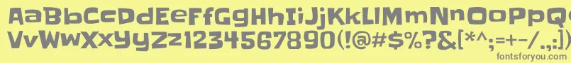 Slackey-fontti – harmaat kirjasimet keltaisella taustalla