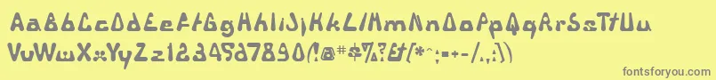 フォントTriangul – 黄色の背景に灰色の文字