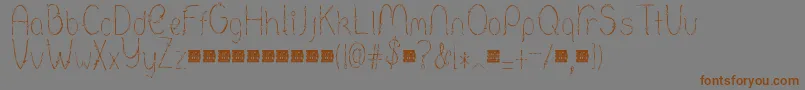 Barbed-Schriftart – Braune Schriften auf grauem Hintergrund