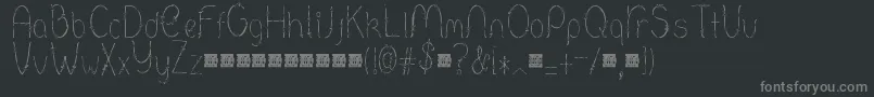 フォントBarbed – 黒い背景に灰色の文字