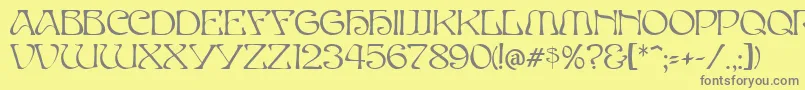 ElvesNormal-Schriftart – Graue Schriften auf gelbem Hintergrund