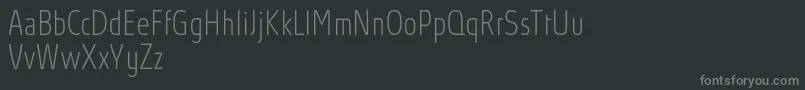 AbsolutProThincondensed Font – Gray Fonts on Black Background