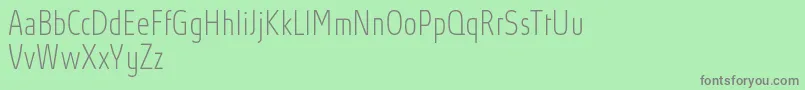 AbsolutProThincondensed Font – Gray Fonts on Green Background