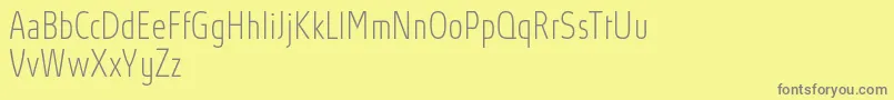 AbsolutProThincondensed Font – Gray Fonts on Yellow Background