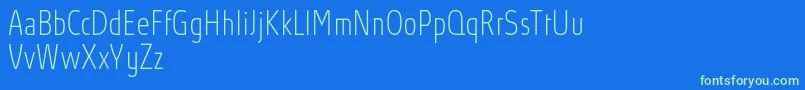 AbsolutProThincondensed Font – Green Fonts on Blue Background