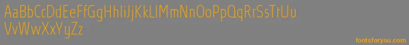 AbsolutProThincondensed Font – Orange Fonts on Gray Background