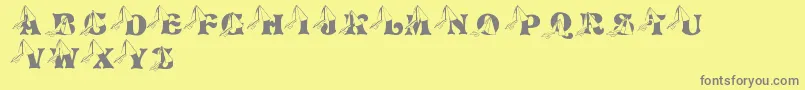 Fonte LmsPrincessCap – fontes cinzas em um fundo amarelo