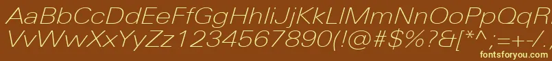 UniversNextProThinExtendedItalic-fontti – keltaiset fontit ruskealla taustalla