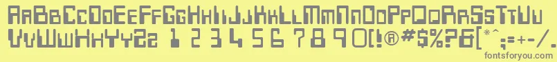 More about Keypunch Font Keypunch Font – Gray Fonts on Yellow Background