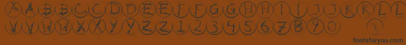 Inkalphabetrrings Font – Black Fonts on Brown Background
