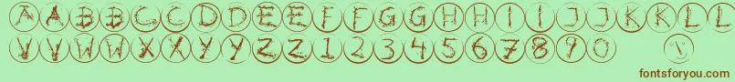 Inkalphabetrrings Font – Brown Fonts on Green Background