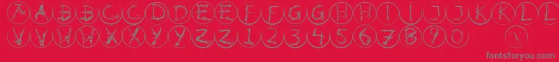 フォントInkalphabetrrings – 赤い背景に灰色の文字