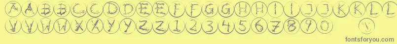 Inkalphabetrrings Font – Gray Fonts on Yellow Background