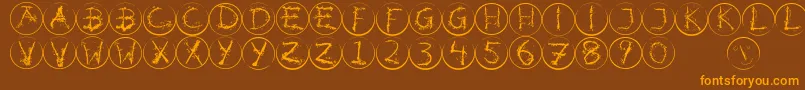 Inkalphabetrrings Font – Orange Fonts on Brown Background