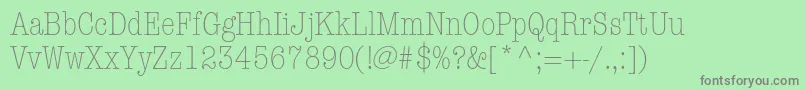 AmericantypewriterstdLtcnd-fontti – harmaat kirjasimet vihreällä taustalla