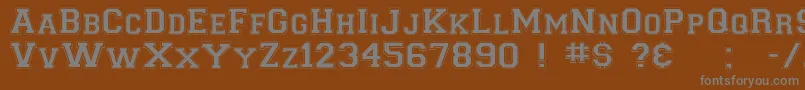 Collegiateflf-fontti – harmaat kirjasimet ruskealla taustalla