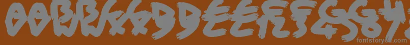 フォントBriskBristleBrush – 茶色の背景に灰色の文字
