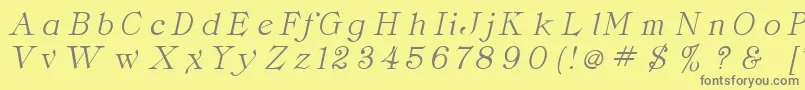 フォントClaritaItalic – 黄色の背景に灰色の文字