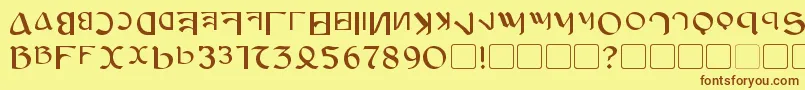 フォントAnayanka – 茶色の文字が黄色の背景にあります。