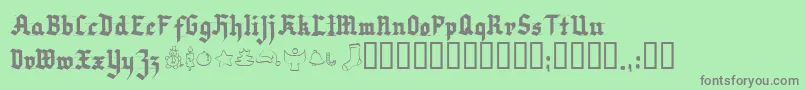 Very Christmess-fontti – harmaat kirjasimet vihreällä taustalla