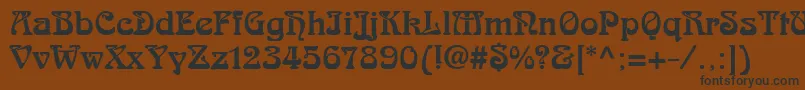 フォントSkazkfor – 黒い文字が茶色の背景にあります