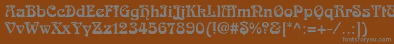 フォントSkazkfor – 茶色の背景に灰色の文字