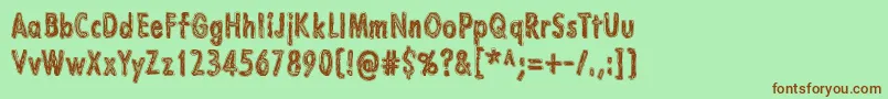 LazarusOz Font – Brown Fonts on Green Background