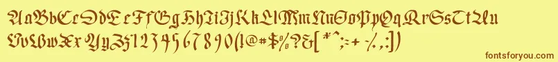 フォントWrittenfrax – 茶色の文字が黄色の背景にあります。