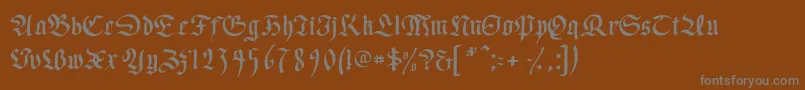 フォントWrittenfrax – 茶色の背景に灰色の文字