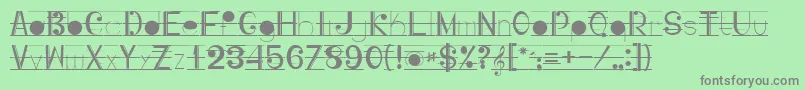 フォントMusicografi – 緑の背景に灰色の文字