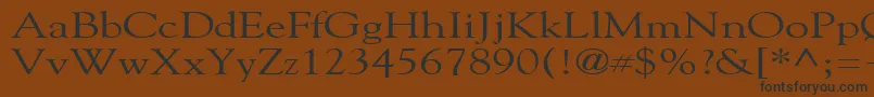 フォントGildebroadRegular – 黒い文字が茶色の背景にあります